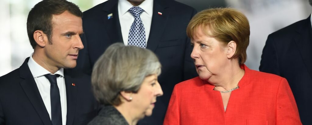 Emmanuel Macron, Angela Merkel and Theresa May at the G7 summit